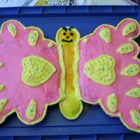 Butterfly Cupcake Cake This is the first Cupcake Cake I have done. Can anyone give me suggestions about how to make it even instead of lopsided?