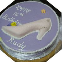 16Th Birthday Cake covered in MMF. Shoe is a sugar mold. Royal icing flowers.
