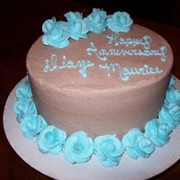 Brown And Blue My brother wanted his anniversary cake in choc since the wedding cake was in vanilla. So we did the same shade roses and chocolate backgrou...