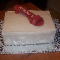 Shoe And Shoe Box Red gumpaste shoe, with the name and age in white fondant. Shoe box covered in fondant. I used an impression mat to put the design on the...