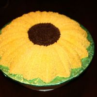 Sunflower_And_Gift_Cake_002.jpg Gift I made for a friend. The sunflower was her Mother's favorite flower.