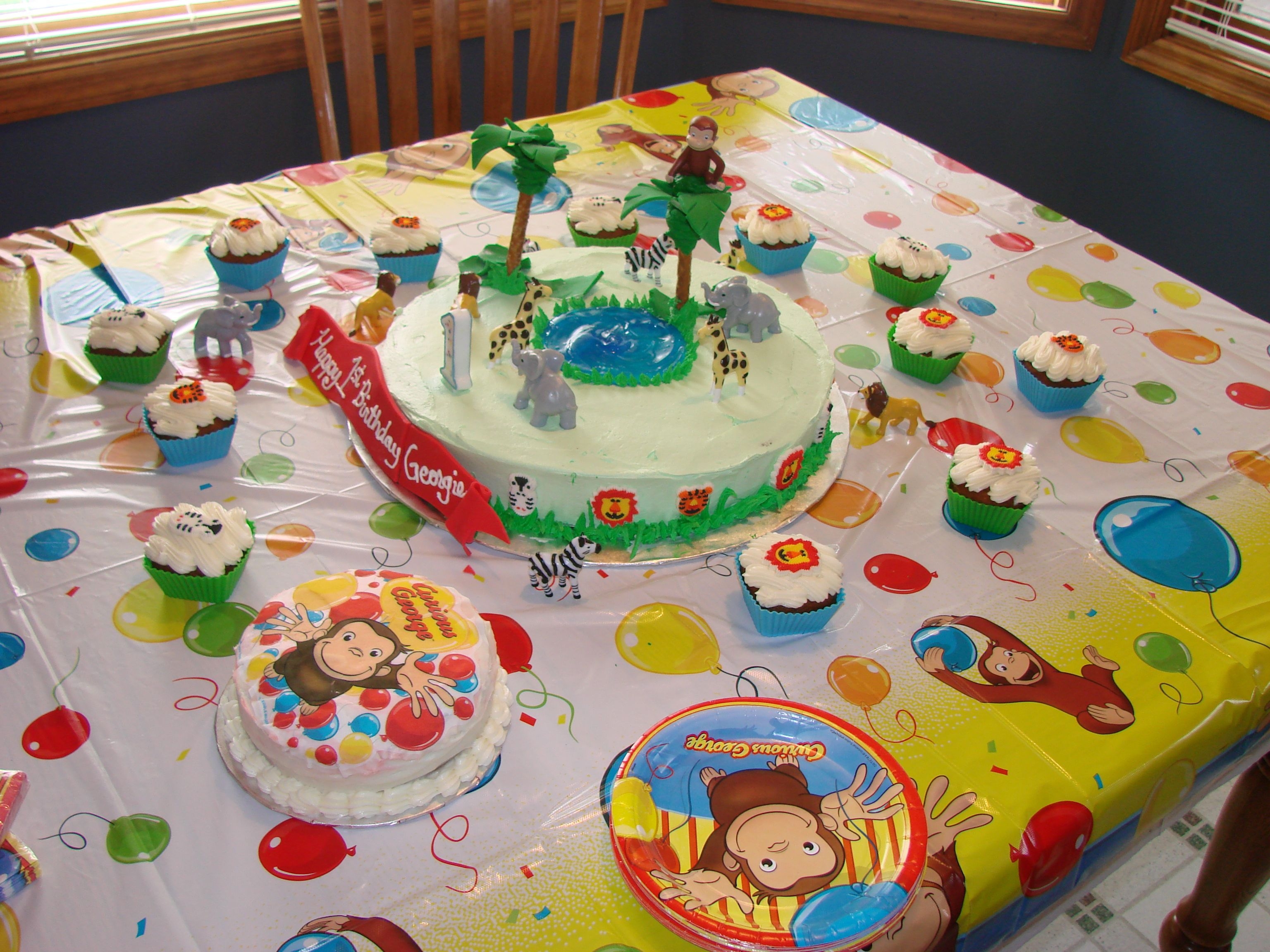 Curious George's Jungle I made this cake for my son George's 1st birthday. My first attempt at something this large. I cut myself short on time so it was...
