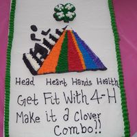4-H Cake Cake made for our 4-H awards banquet. Art work on cake is based off of the art for the years 4-h focus.Im up for suggestions on this cake...