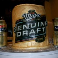 Miller Genuine Draft I made this cake for my Husband's birthday. MGD is his drink of choice. This was a lot of first. First time using MMF, edible transfer...