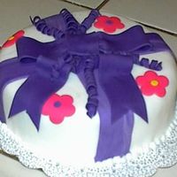First Fondant Cake Course 3 This is my first cake ever using fondant. Used the Wilton fondant for class 2. Enjoyed using fondant. Did in pink and purple (...