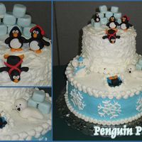 Penguin Party! Cake I made for our family white elephant party. (This is why there is an elephant in the artic!) Buttercream frosting with fondant accents...