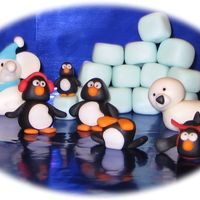 Arctic Family These little fondant guys are all ready for our white elephant family Christmas party! This explains the little white elephant in the mix....