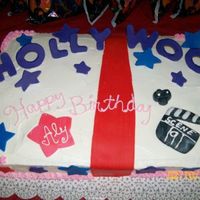 Hollywood! The finished Hollywood themed cake! Yello cake with Buttercream and fondant decor.