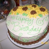Happy Birthday Sunflowers A Cake that i made for a friends mother. It was my very first time making buttercream sunflowers, i tought myself from the wilton website....