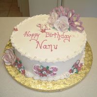 Fancy-Full Rose This is an all buttercream cake with small chocopan flowers (chocopan has a nice flavor and will make them more edible). The roses and...