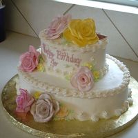 Rose Romance This Cream Cheese icing cake was decorated with fondant roses and chocopan pearls (chocopan allows for a nice shape and doesn't...