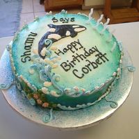 Shamu Theme Cake This Shamu theme cake is buttercream iced with royal icing waves and underwater kelp with flowers. The cake was airbrushed and glistened...