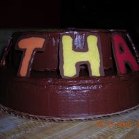 First Real Cake!!! 6" and 8" layer, yellow and chocolate cakes. Hershey's Frosting. Candy Melt decorations. Proud of myself.... not perfect,...