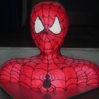 Spiderman Bust Cake my version of the spiderman bust cake. all buttercream. very difficult to get the icing a bright red color. can't wait until I can get...