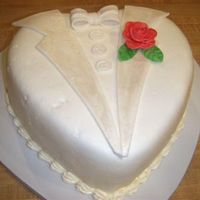 Heart Shaped Tuxedo Cake this was the tuxedo cake i did with the dress cake. thank you boween for your inspiration. everything is fondant except the rose (took me a...
