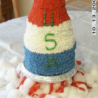 Rocket Cake Made For A Birthday My 5 year old neighbor wanted a rocket that stood up. I think it came out ok. I used 3- 6 inch cakes, 2- 4 inch cakes and 1 mini doll mold...