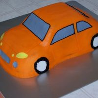 Orange Car I made this for my husband as his groom's cake for our wedding. It looks like his car. It's all buttercream.