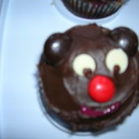 Teddy Bear Cupcakes Chocolate cupcakes with chocolate frosting. Ears are Junior mints. Eyes are white chocolate chips with the eyes piped in using chocolate BC...