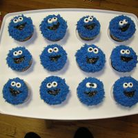 Cookie Monster Cupcakes yellow cake with buttercream. Eyes are made of marshmellows. I used tip 233 to get the fur like appearance. Blue colour was made using a...