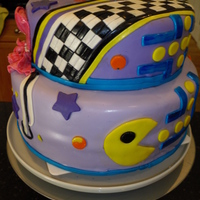 80's Theme Birthday Girl Purple and white citrus vanilla cake with orange buttercream. All fondant decorations.