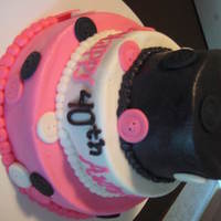 Pink And Black Buttons Wanted to try fondant buttons! This is a 4/6/8 covered in buttercream...