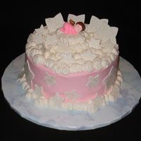 Welcome Angel White Chocolate cake filled with raspberry filling and frosted with buttercream. Stars are fondant with cake glitter.