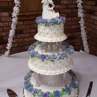 My Nephew's Wedding Cake This was a cake made by a coworker and myself. I baked all the cakes and she came over to help decorate. She taught me the great tip of the...