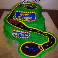 Race Track Made this for a 5yr old boy. Vanilla and Chocolate cake with bc and chocolate clay road. The mom provided the cars. I got my...