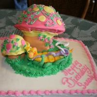 Alice In Wonderland Caterpillar And Mushroom 1/2 sheet cake with fondant covered 3D mushrooms. Caterpillar is done in fondant also...my first time doing much in fondant. Had fun doing...