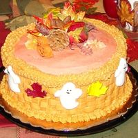 Ghostly Fun Lt orange buttercream frosting w/almond chocolate filling. Basketweave decorated w/marzipan leaves & egg white w/sugar ghosts. Pumpkins...