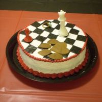 Twilight Cake This cake was made for the Breaking Dawn premiere, a book in the twilight series. The chess pieces are gumpaste and the black squares are...