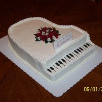 Grand Piano Piano is a 2 layer 1/2 cake cut into the shap of a grand piano. Made out of BC.