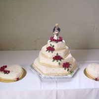 Stacked Hexagonal Satincol. 1:st weddingcake made for our fosterdaughter. COntains lovely rhubarb-strawberrymousse, cream right under homemade sp. Roses in marcipan,...