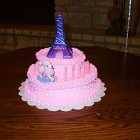 Pink Poodle Cake My DD wanted a pink cake for her bday and it had to have 2 tiers. Got it iced and was starting to decorate when my 23 mo old woke from her...