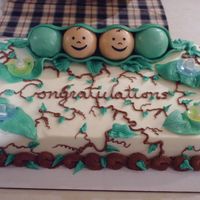 Two Peas In A Pod The peas are RKT covered in fondant, the blooms are actually pacifiers.