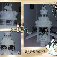 All White Wedding Cake Did this one for a friend and co-worker several years ago. All white Royal roses, stringwork, arches. White cherubs, and angels on the...