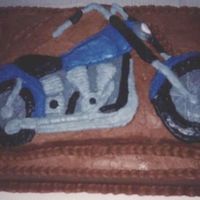 Motorcycle Grooms Cake I tried to get the color to match a pic of the groom's bike. Oh well,it tasted pretty good.