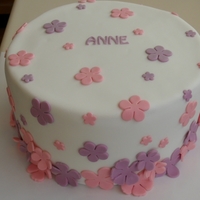 Flowers For Anne Chocolate buttermilk cake filled with white chocolate buttercream. Covered in ganache then fondant. Gumpaste decorations. The little...