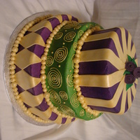 New Years Eve/ Mardi Gras Themed Cake Iced in buttercream, airbrushed, covered in gold fondant decorations