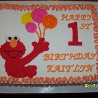 100_3043.jpg This is an Elmo cake that I did for my niece's first birthday. I used fondant for Elmo and for the number one. The rest is buttercream...