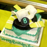 Mighty Duck Hockey Cake for ice skating Party lots of fondant