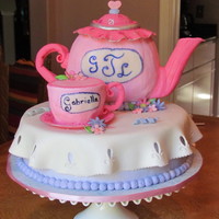 Tea Party Gabriella turned 4 and celebrated with a tea party inviting all her friends. Fondant used for the handles, spout and lid, used pumpkin cake...