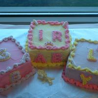 Baby Blocks This was a cake for a baby shower for a co-worker. The accessories are plastic. The cake is iced and decorated in BC. I used the Crisco...