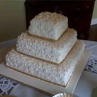 50Th Anniversary I made this cake for a friends parents 50th. White cake cover with fondant and royal icing swirls.