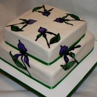 Orchid Cake The cake is vanilla cake covered with fondant nd the orchids are hand painted using food loring paste..thanks ffor looking