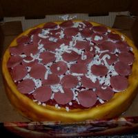 Pizza Cake 12" french vanilla cake, with fondant. I airbrushed the cake to look like a pizza crust and mad the buttercream look like pizza sauce...