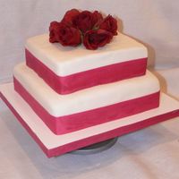 Square Cake With Roses it's a 2 tier cake using 8" and 10" square cake pans. The cake is vanilla and I covered it with fondant and used ribbon and...