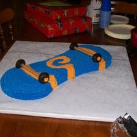 Skateboard Birthday Cake Cake for my nephew, he loved it. Buttercream, donuts and those wafer thingies.