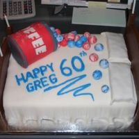 Bed And Marbles Cake for my step-father's 60th Birthday. All but headboard and footboard are rolled fondant. Coffee can is cake. Marbles and can are...