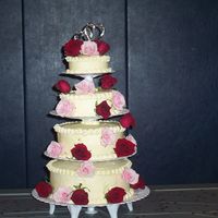 40Th Anniversary I made this for my parents' 40th anniversary. 4 different flavored cakes with different fillings. all butter cream icing, real fresh...